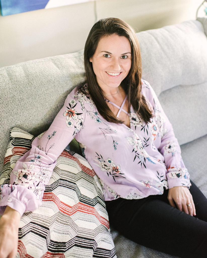 Smiling Woman On Her Couch In Denver